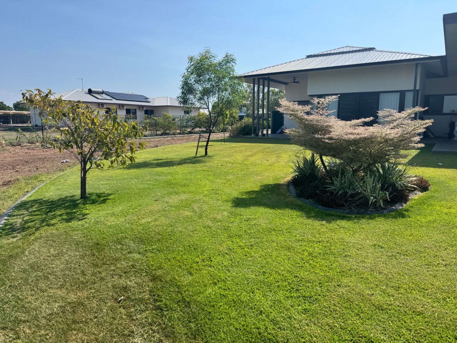 Finished landscaping project with greenery and tidy garden in Muirhead, Northern Territory by iScape NT