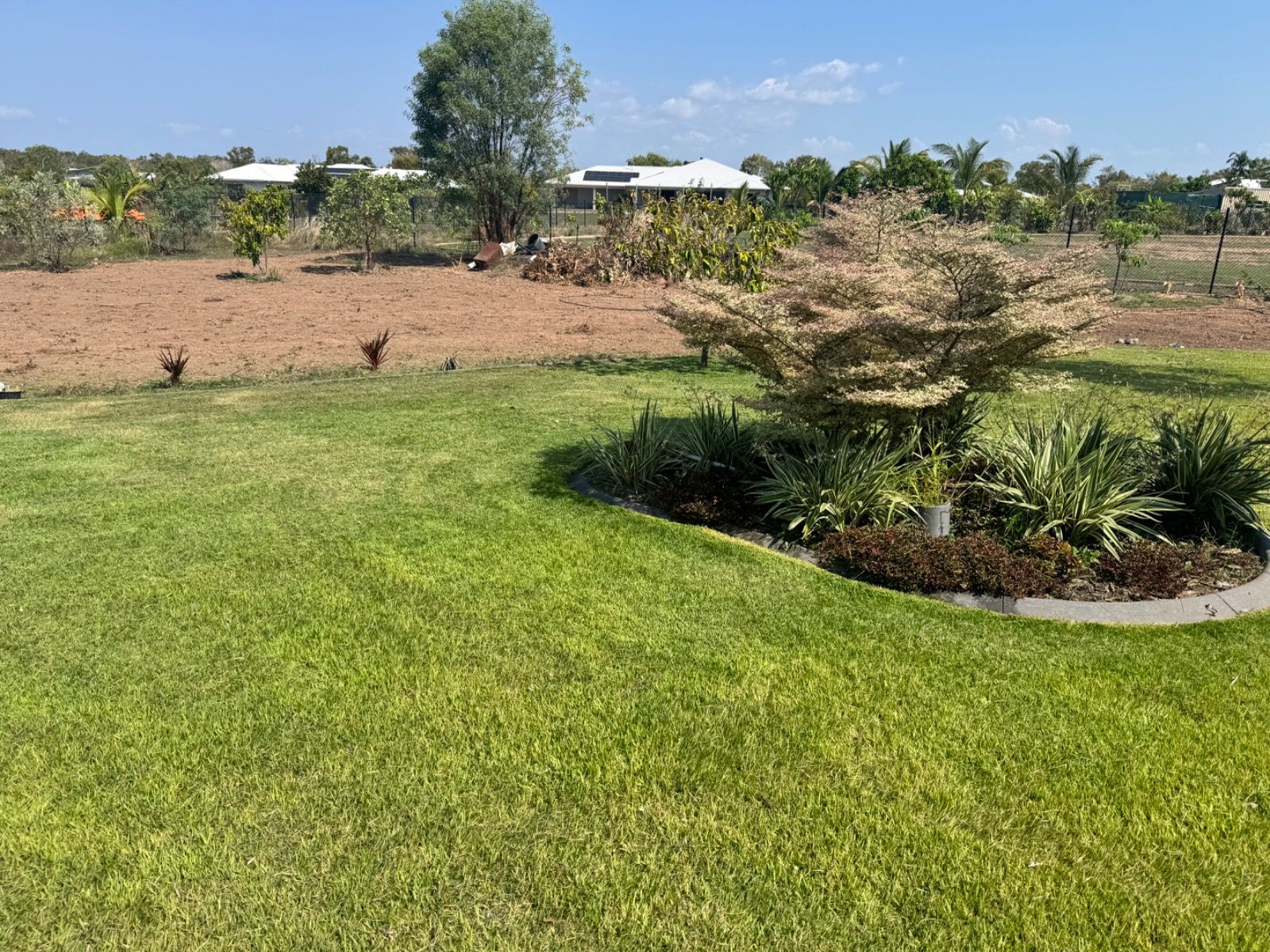Finished outdoor area after service completed by iScape NT in Muirhead Northern Territory showing tidy and well-maintained landscape.