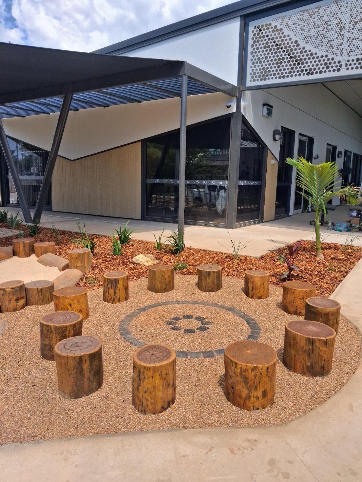 After photo showing completed landscaping work with tidy, green garden area in Parap NT