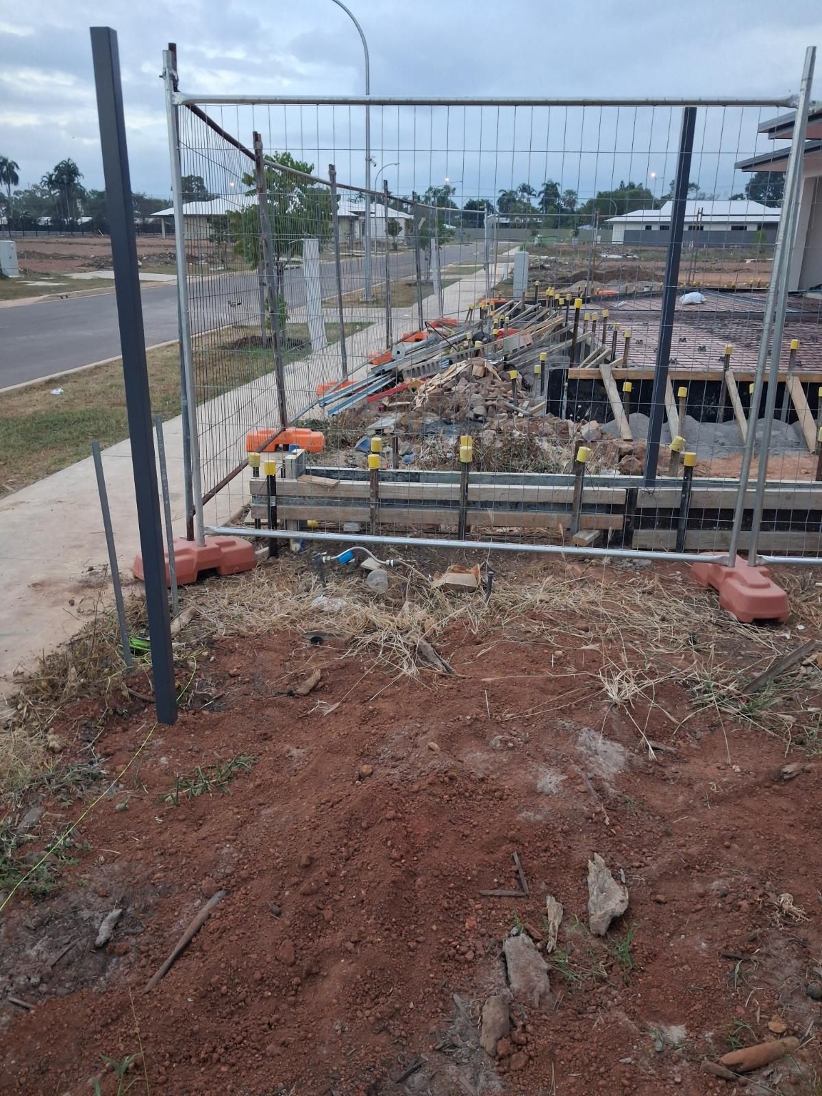 Outdoor area at Marrara Gardens in NT before landscaping work by iScape NT, showing natural garden surroundings.