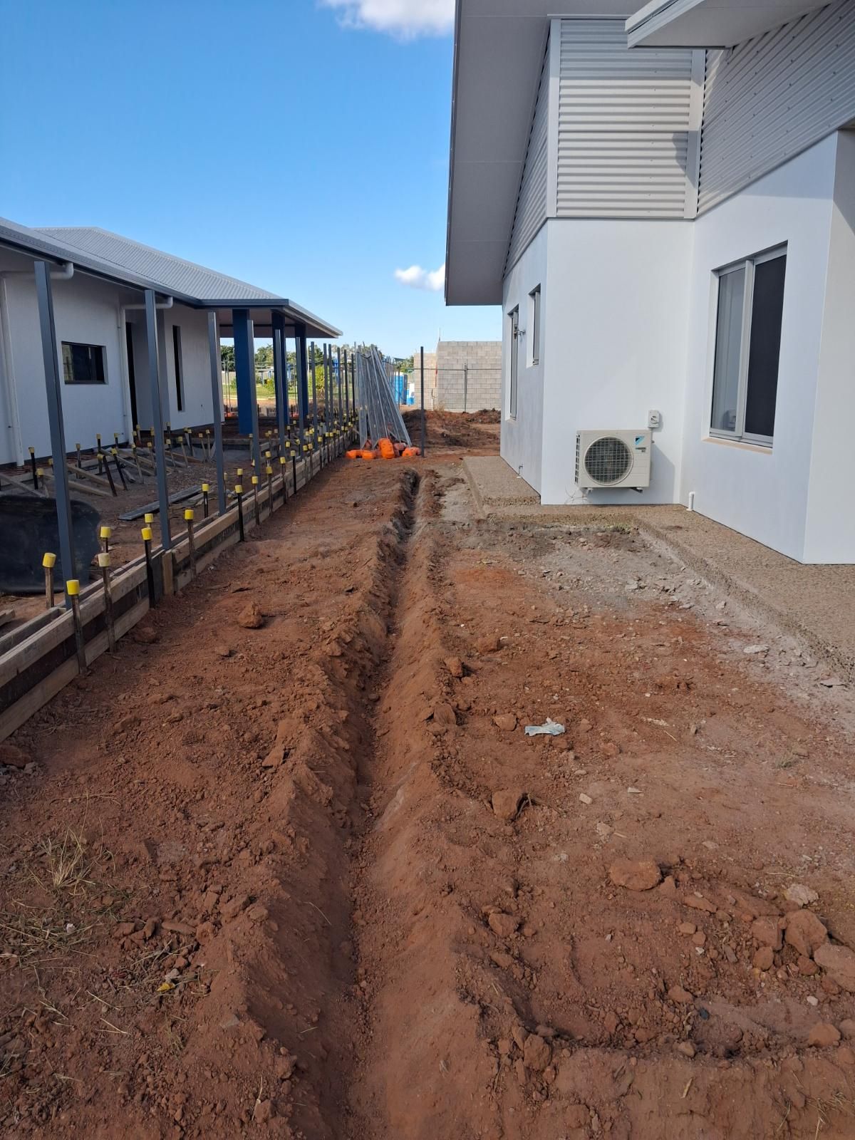 Completed landscaped garden area in Marrara Gardens with fresh soil, new plants, and tidy arrangement