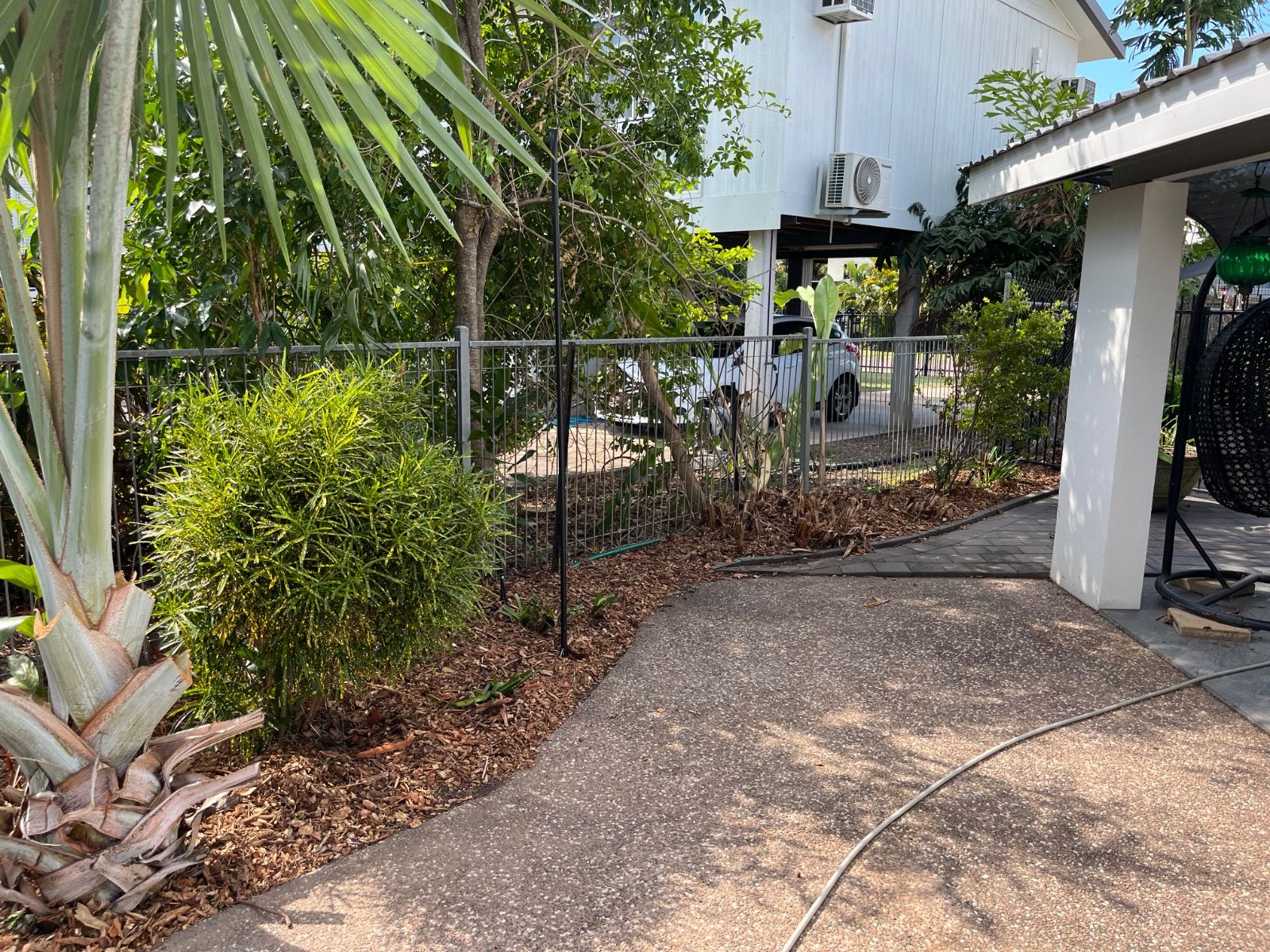 Completed landscaping with fresh greenery and tidy garden beds in Leanyer after renovation